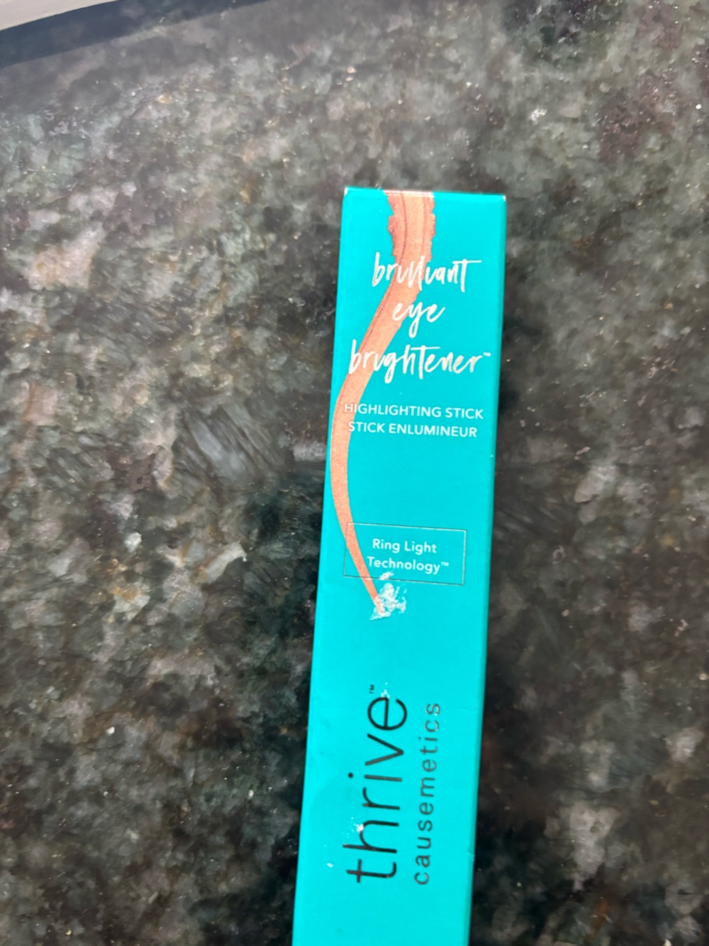 thrive causemetics Highlighting Stick Brightener in Teal Packaging